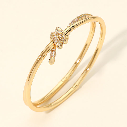 CZ Pave Knot Accent Hinged Bangle Bracelet in Gold